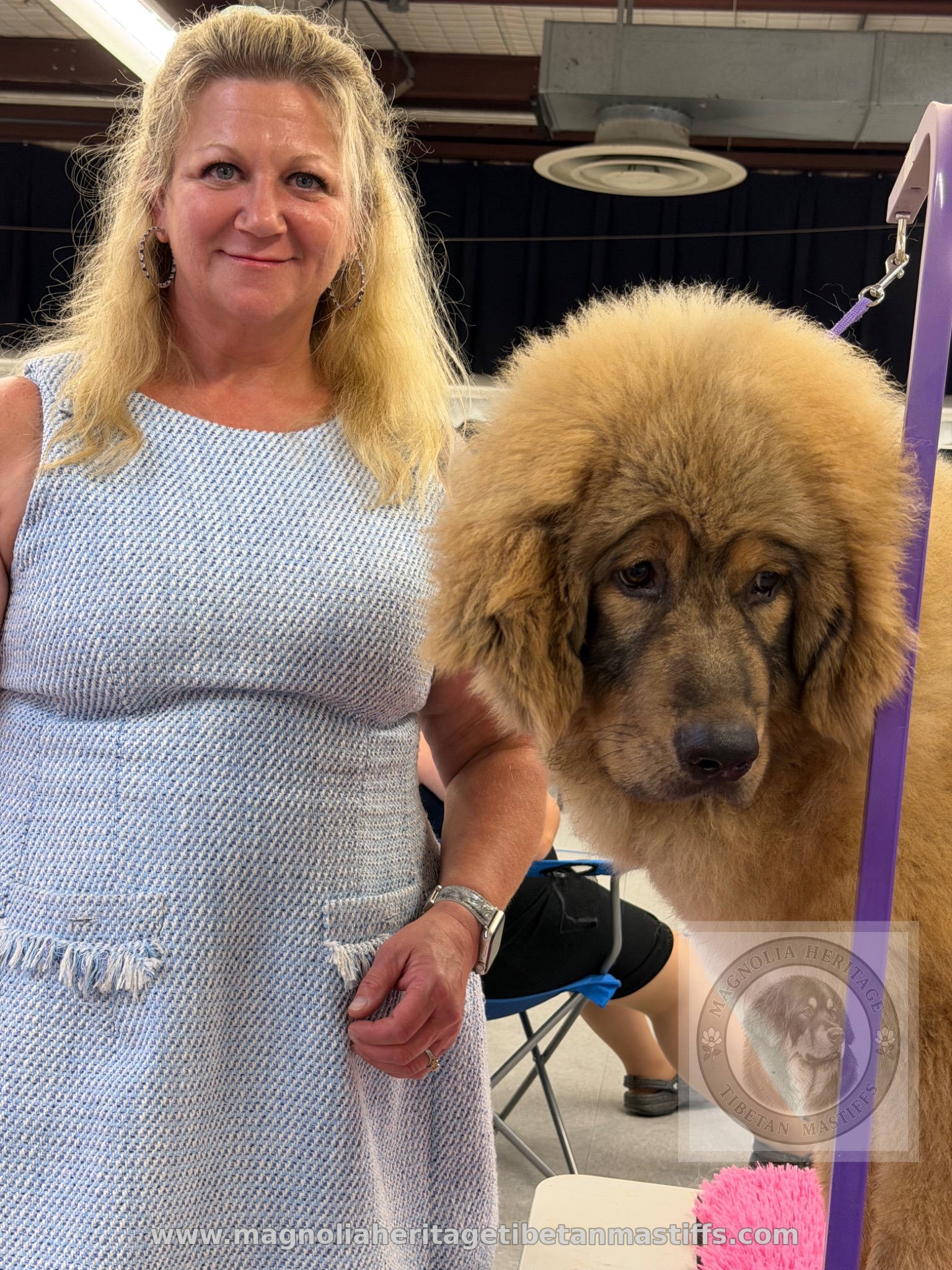 Michelle standing with Rinchen in the grooming area