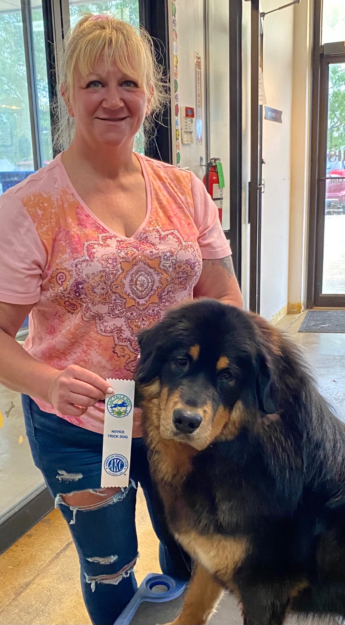 Zaya with novice trick dog ribbon